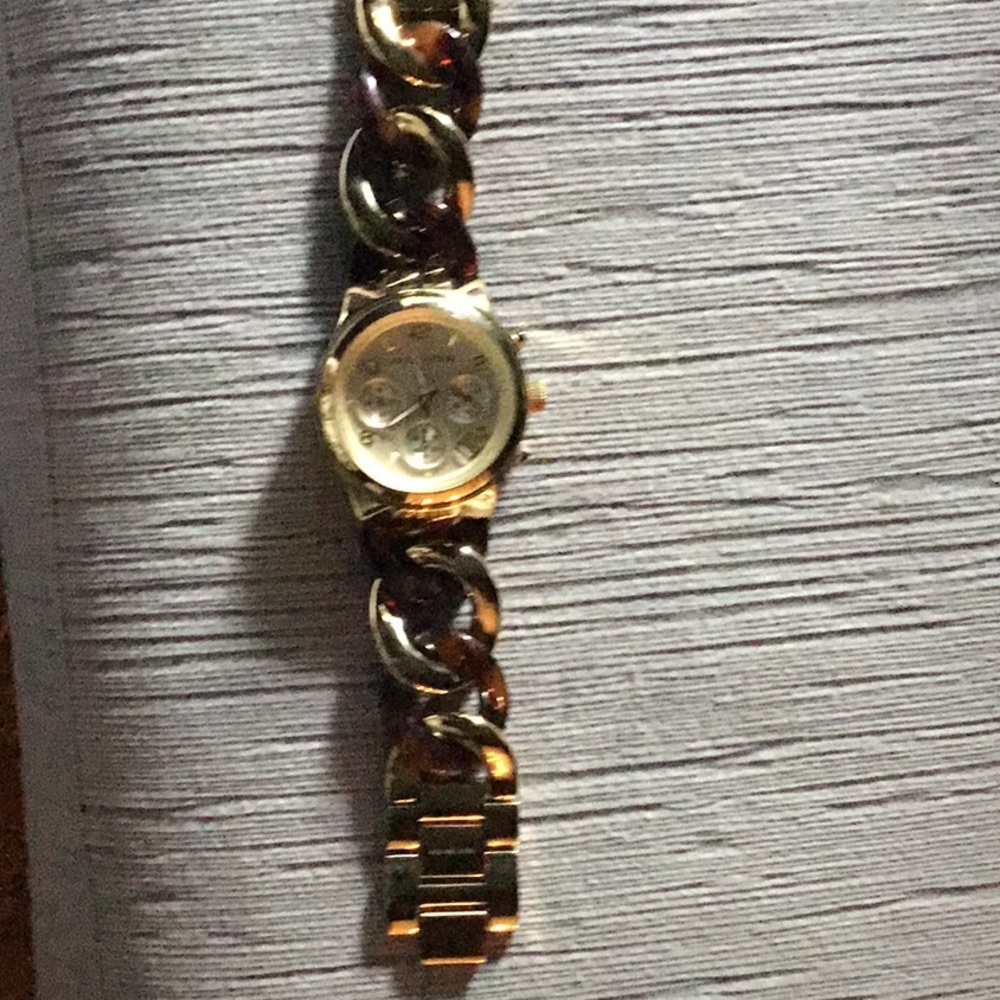 Micheal Kors tortoise and gold watch.